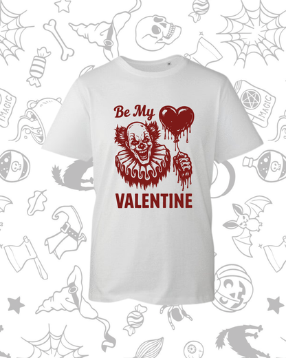White t-shirt with dark red graphic of a sinister clown face, a dripping heart, and text saying "Be My Valentine".